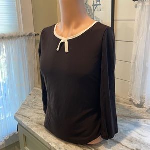 Beautiful brown w trim around neck